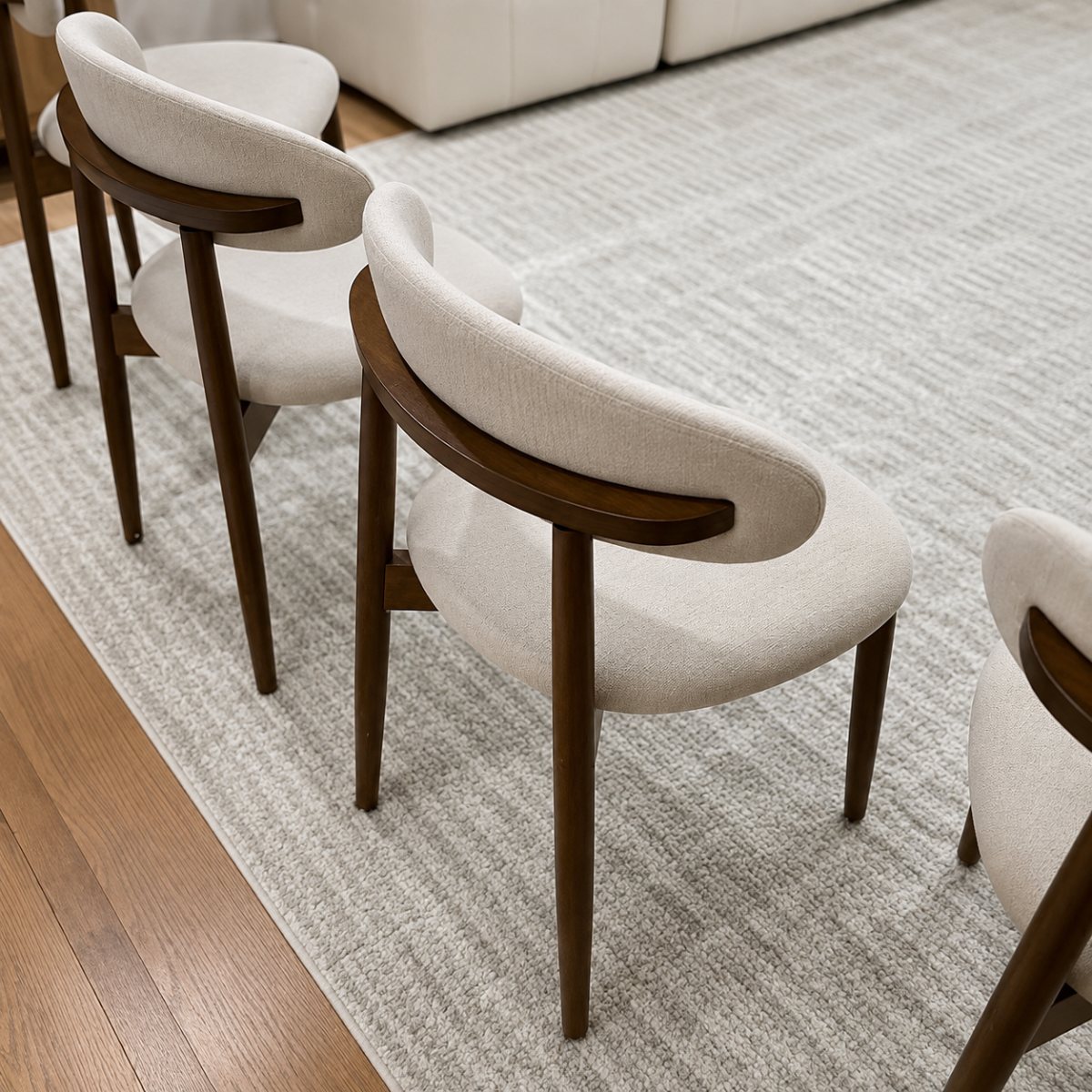 Bellamy Oval upholstered dining chair and walnut fluted pedestal detail