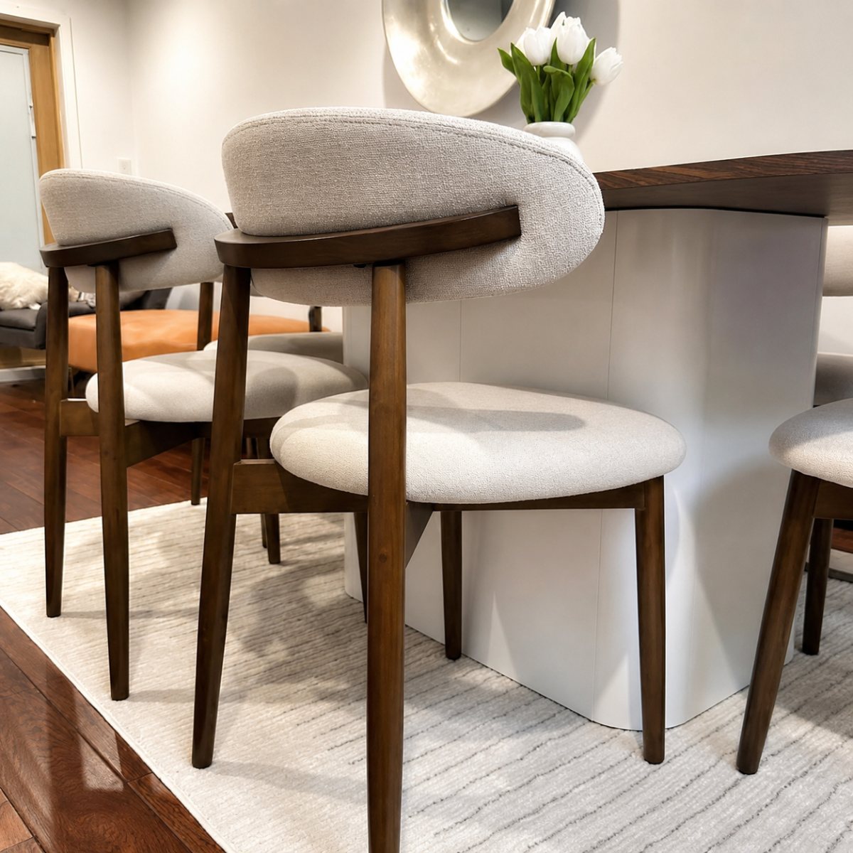 Harper Chair walnut dining chairs with cream fabric, styled at a table