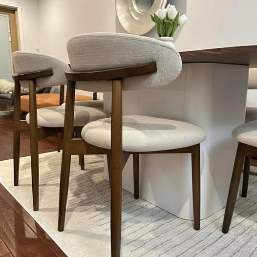 Marlow Set cream upholstered dining chair and slatted walnut pedestal detail