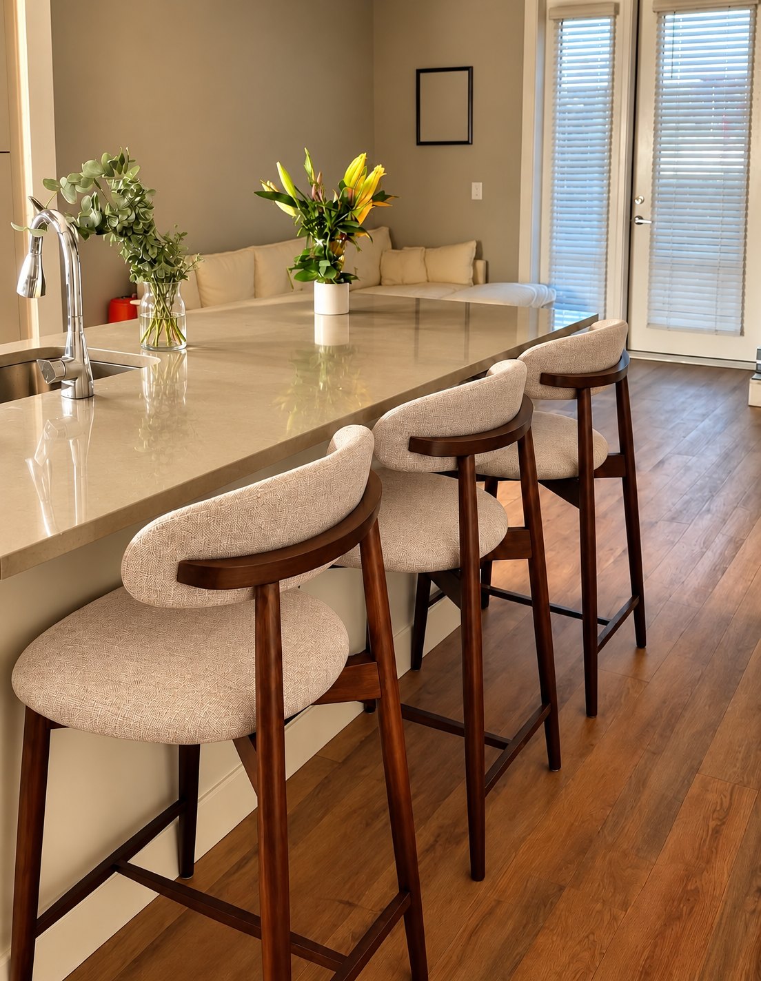 Rhea Barstool — three counter stools in dark walnut with cream bouclé seats along a kitchen island (view 1 of 3)